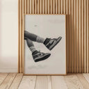 Black and white sneaker artwork framed beautifully, enhancing contemporary space decor.