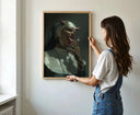A woman holding the Sinful Sister – Devil Horn Nun Art Print for display, focusing on its unique design.