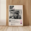 Taylor Swift's iconic pose featured in poster with stylish details and signature in black and white.