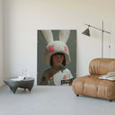 Styled Urban Bunny Muse Surreal Fashion Art Print displayed on a modern wall in a cozy living room setting.