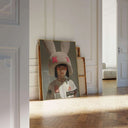 Urban Bunny Muse Surreal Fashion Art Print leaning against a wall with a light wooden floor, showcasing urban decor.