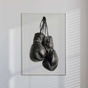 Vintage Boxing Gloves Wall Art showcasing gloves on a minimalist white background, perfect for modern aesthetics.