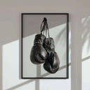 Vintage Boxing Gloves Wall Art featuring striking shadows and a modern frame, enhancing room decor.