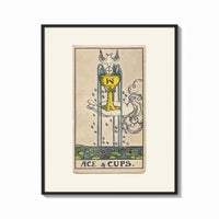 Framed Ace of Cups tarot card print shown as a bold statement piece on a clean gallery wall