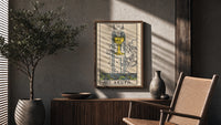 Ace of Cups poster framed above a fluted sideboard beside a potted tree
