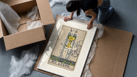 Ace of Cups tarot card framed print being unpacked from protective bubble wrap and a box