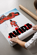 Boy and red motorcycle print laid flat in a styling flatlay