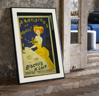 Woman in yellow eating biscuit print in a black frame leaning beside a vintage door on parquet