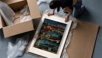 Antibes coastal town scene framed print being unpacked from protective bubble wrap and a box