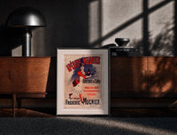 Black-framed woman serving aperitif on tray print on a moody console with designer coffee-table books