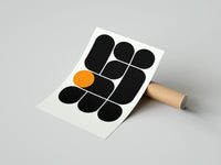 Gently curled Arches Composition print beside its protective shipping tube
