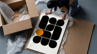 Arches Composition framed print being unpacked from protective bubble wrap and a box