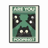 Framed Are You Pooping Three Cats print shown as a bold statement piece on a clean gallery wall