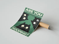 Gently curled Are You Pooping Three Cats print beside its protective shipping tube