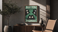 Are You Pooping Three Cats poster framed above a fluted sideboard beside a potted tree