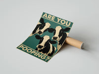 Gently curled Are You Pooping Three Cows print beside its protective shipping tube