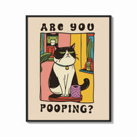 Framed Are You Pooping Tuxedo Cat print shown as a bold statement piece on a clean gallery wall