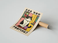 Gently curled Are You Pooping Tuxedo Cat print beside its protective shipping tube