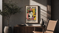 Are You Pooping Tuxedo Cat poster framed above a fluted sideboard beside a potted tree