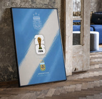 FIFA World Cup 2026 Argentina logo print in a black frame leaning beside a vintage door on parquet