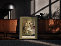 Black-framed Scrooge visiting nephew at dinner print on a moody console with designer coffee-table books