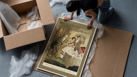 Scrooge visiting nephew at dinner framed print being unpacked from protective bubble wrap and a box