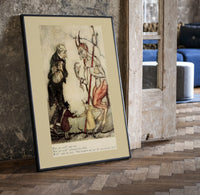 Devil with pitchfork and old man print in a black frame leaning beside a vintage door on parquet