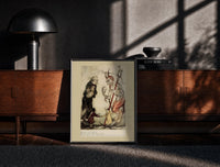 Black-framed Devil with pitchfork and old man print on a moody console with designer coffee-table books