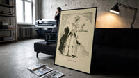 Woman in gown carrying pudding tray print in a slim black frame leaning on a dark sofa in a concrete print studio