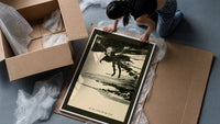 Ghostly figure flying over landscape framed print being unpacked from protective bubble wrap and a box