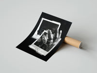 Gently curled ASAP Rocky At Long Last Rings print beside its protective shipping tube