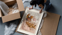 Santa Claus in reindeer-drawn sleigh framed print being unpacked from protective bubble wrap and a box