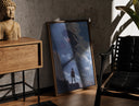 Walnut-framed Soldier facing colossal titan print leaning against a sunlit rustic brick wall