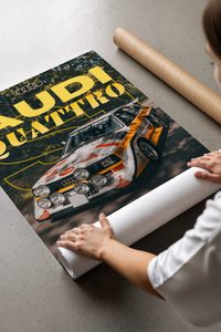 Woman unrolling the Audi rally poster showing yellow typography and the S1 car on a concrete floor