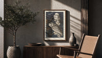 Two snowy owls on branch poster framed above a fluted sideboard beside an olive tree