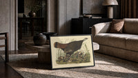 Female wild turkey with chicks print in a slim black frame leaning on a travertine coffee table