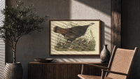 Female wild turkey with chicks print in a wood frame above a fluted sideboard beside an olive tree