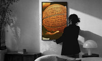 Basketball Covered in Handwriting print in a slim black frame being hung on a sunlit wall in a monochrome room