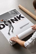 Woman opening a Basketball Dunk Motivation wall art poster from crush-resistant brown shipping tube