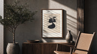 Woman in black gown and hat poster framed above a fluted sideboard beside an olive tree