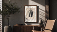 Woman holding severed head poster framed above a fluted sideboard beside an olive tree