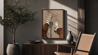 Beige Sneakers and White Socks poster framed above a fluted sideboard beside a potted tree