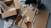 Beige Sneakers and White Socks framed print being unpacked from protective bubble wrap and a box