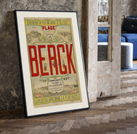 Berck beach seaside resort advertisement print in a black frame leaning beside a vintage door on parquet