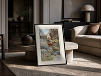 Woman rowing boat on lake print in a black frame leaning on a travertine table in a sunlit lounge