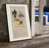 Birds on branch with holly print in a black frame leaning beside a vintage door on parquet