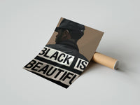 Gently curled Black Is Beautiful Cap print beside its protective shipping tube