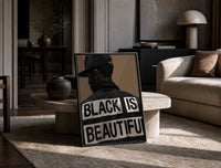 Black Is Beautiful Cap print on the floor, leaning against a travertine table
