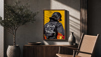 Black Is Beautiful Flame Jacket poster framed above a fluted sideboard beside a potted tree