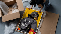 Black Is Beautiful Flame Jacket framed print being unpacked from protective bubble wrap and a box